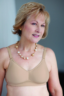 Image of woman wearing beige mastectomy bra