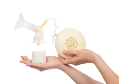 Image of breast pump being held by female hands